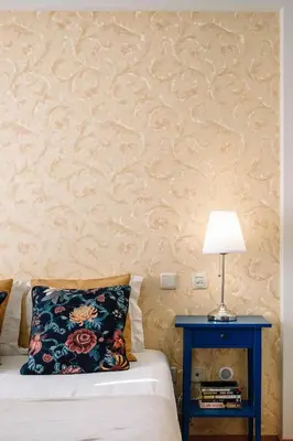 a bedroom with a bed and a table with a lamp at BBA Apartments Boavista - Casa da Música with free parking in Porto