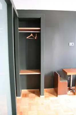 a room with a desk and a table and a shelf at 2U Oporto Urban Stays in Porto