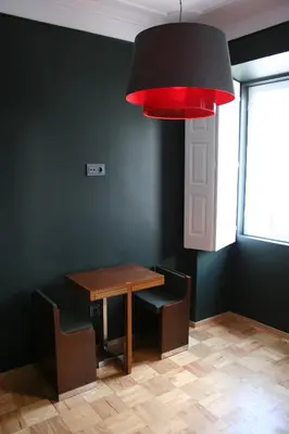 a dining room with a table and a red light at 2U Oporto Urban Stays in Porto