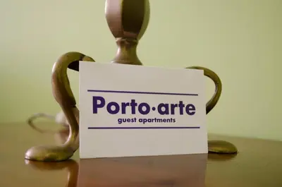 a sign that says potatoire on a table at Porto.arte guest apartments in Porto