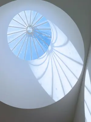 a window with a blue umbrella sticking out of it at New Oporto Apartments - Mouzinho in Porto
