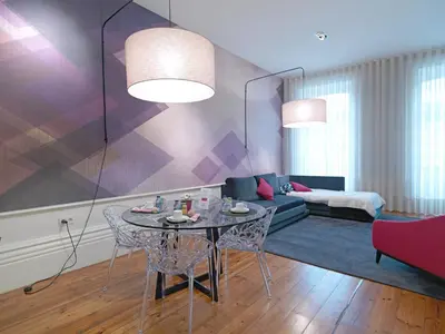 a living room with a table and a couch at New Oporto Apartments - Mouzinho in Porto
