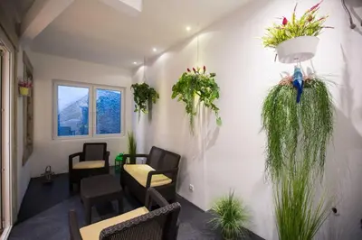 a waiting room with chairs and plants on the wall at GuestReady - Eiffel Waterfront apartments in Porto