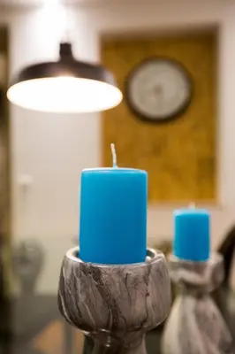 a blue candle sitting on top of a table at GuestReady - Eiffel Waterfront apartments in Porto