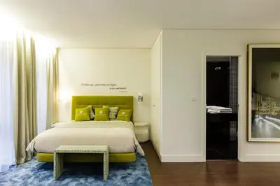 a living room with a couch and a painting on the wall at Porto Old Town – Tourism Apartments in Porto