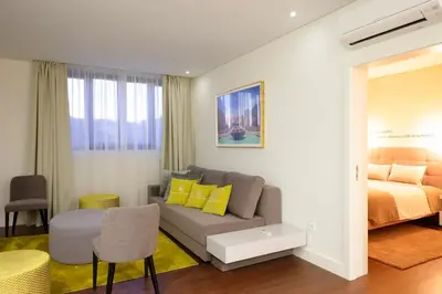 a living room with a couch and a bed at Porto Old Town – Tourism Apartments in Porto