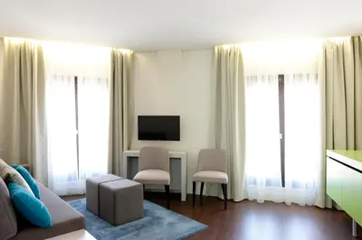 a hotel room with a bed and a table at Porto Old Town – Tourism Apartments in Porto