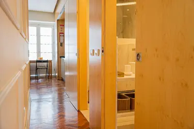 a hallway leading to a kitchen with a table at Impar Luxury Apartments in Porto