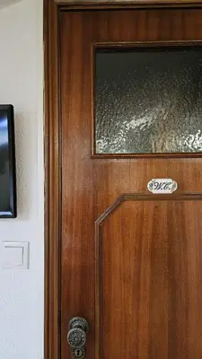 a wooden door with a window on top of it at Suite Porto in Porto
