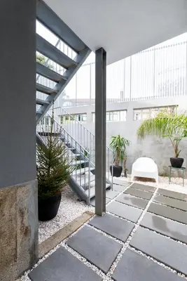 a courtyard with potted plants and a building at Charm Palace Porto in Porto