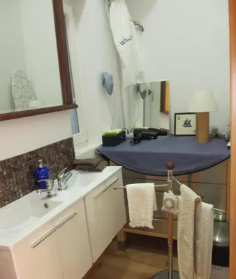 a bathroom with a sink and a blue table at Porto Douro River Guest House in Porto