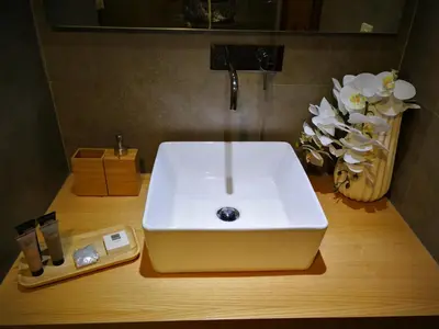 a white sink on a wooden counter in a bathroom at Douro View Apartment in Vila Nova de Gaia