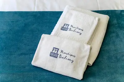 two towels with the words maimonides baby bakery on them at Monchique´s Balcony in Porto