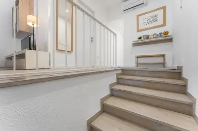 a hallway with stairs in a building at Casa Trindade in Porto