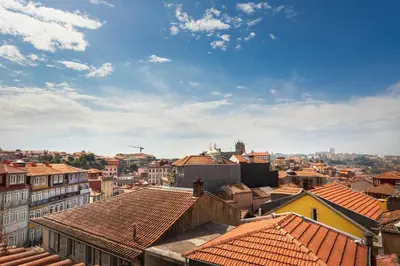 a view of the roofs of a city at Own Places Clérigos Apartments in Porto