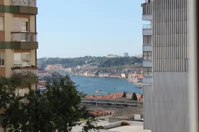 a view of a river between two buildings at Avenida Apartment by MP in Vila Nova de Gaia