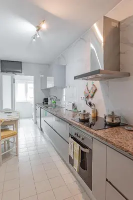 a kitchen with a counter top with pots and pans at Avenida Apartment by MP in Vila Nova de Gaia