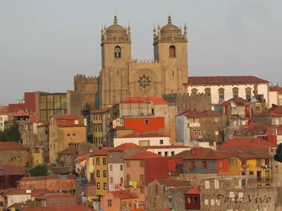 a view of a city with buildings and a church at PortoVivo Bonjardim Apartamento in Porto
