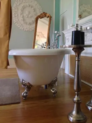 a white bath tub with a sink and a mirror at Boavista Eco-Luxury House in Porto