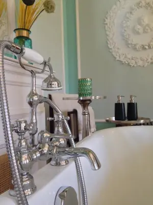 a bathroom with a bath tub with a sink at Boavista Eco-Luxury House in Porto