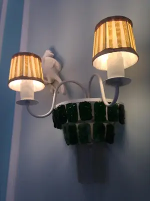 two lights on a wall with green stones on it at Boavista Eco-Luxury House in Porto