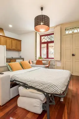 a hospital bed in a room with a kitchen at Discovery | Porto-Flores in Porto