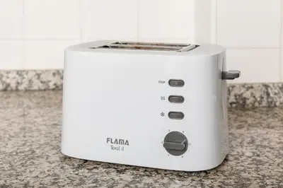 a white toaster sitting on top of a counter at Discovery | Porto-Flores in Porto