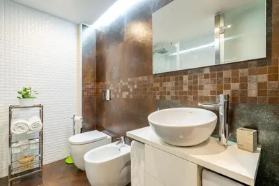 a bathroom with a sink and a toilet at Merc Porto Santa Catarina in Porto