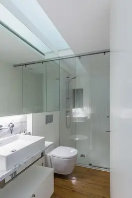 a bathroom with a sink and a toilet and a shower at GuestReady - Picaria Living Quarters in Porto