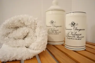 a white teddy bear sitting next to two bottles of milk at T2P Félix House in Vila Nova de Gaia