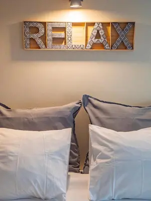 two pillows sitting on a bed in a room at Studio 312 - With Free Parking in Porto