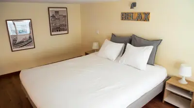 a bedroom with a large bed with white sheets at Studio 312 - With Free Parking in Porto