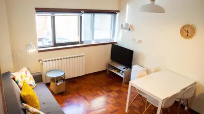 a hallway with a living room with a couch at Studio 312 - With Free Parking in Porto