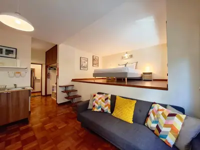 a kitchen with a white table and white chairs at Studio 312 - With Free Parking in Porto