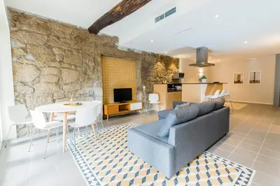 a living room with a couch and a table at Oporto Trendy River in Porto