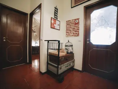 a hallway with a door and a cage on a cart at OPORTO GUEST Harry Potter flat with Parking in Porto
