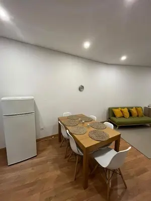 a bedroom with a bed with two pillows on it at Down Bonjardim Apartments in Porto