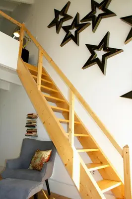 a room with a staircase with stars on the wall at Oporto Chic&Cozy - Batalha in Porto