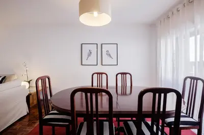 a dining room with a table and chairs at Music House 3 bedroom Apt w garage in Porto