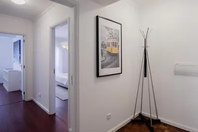 a room with a picture on the wall and a tripod at Music House 3 bedroom Apt w garage in Porto