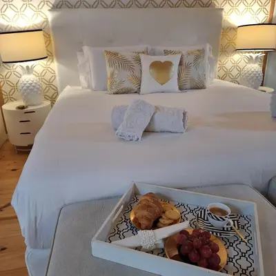 a living room with a tray of food on a table at Oporto Golden Apartment in Porto