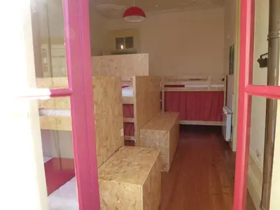 a room with a bunch of bunk beds at Canvas Atelier Hostel in Porto