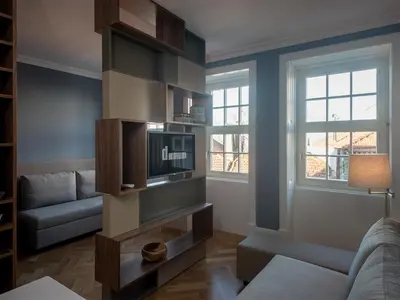 a living room with a couch and a tv at Domum 2 in Porto