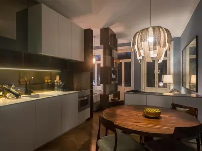 a kitchen with a wooden table and a dining room at Domum 2 in Porto