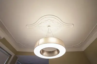 aandelier hanging from a ceiling in a room at daPraça Apartments in Porto
