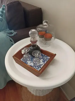 a white table with a tray with cupcakes on it at daPraça Apartments in Porto