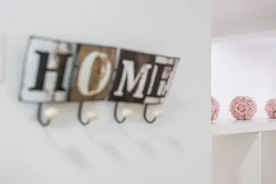 a shelf with a hmc sign on a wall at Oporto Downtown View Apartment in Porto
