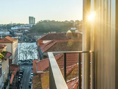 a view of a city from a balcony at Ribeiredge Guest House in Porto