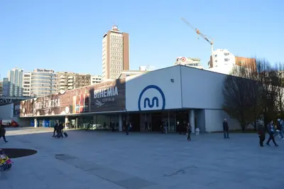 a building with a sign on it in a city at Oporto Old In New in Porto
