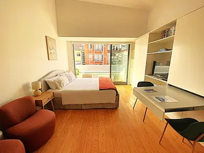 a bedroom with a bed and a desk and a chair at PORTO SWEETHEART - Almada in Porto